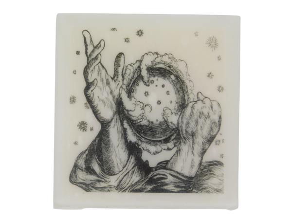 square shaped soap with a vintage illustration of two hands conjuring the universe