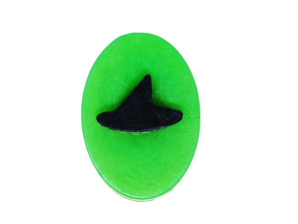 slime green oval soap topped with a black witch hat